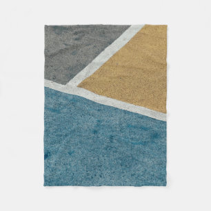 Closeup grey, yellow, and blue painted pavement fleece blanket