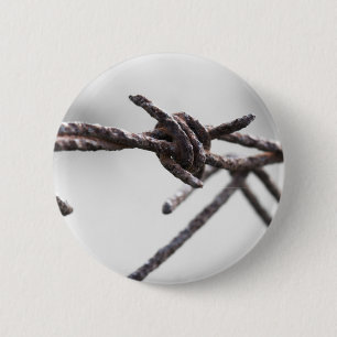 Closeup of barbed wire 2 inch round button