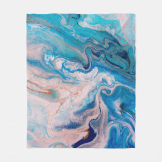 Closeup of mixed blue and white abstract marble te fleece blanket