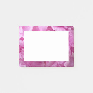 Closeup of pink peonies post-it notes