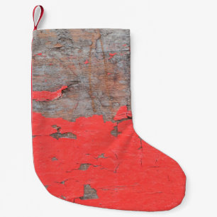 Closeup old and peeling painted wood board backgro small christmas stocking