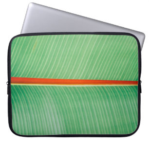 Closeup photo of green leaf laptop sleeve