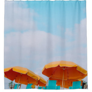 Closeup photo of lounger chairs and beach umbrella
