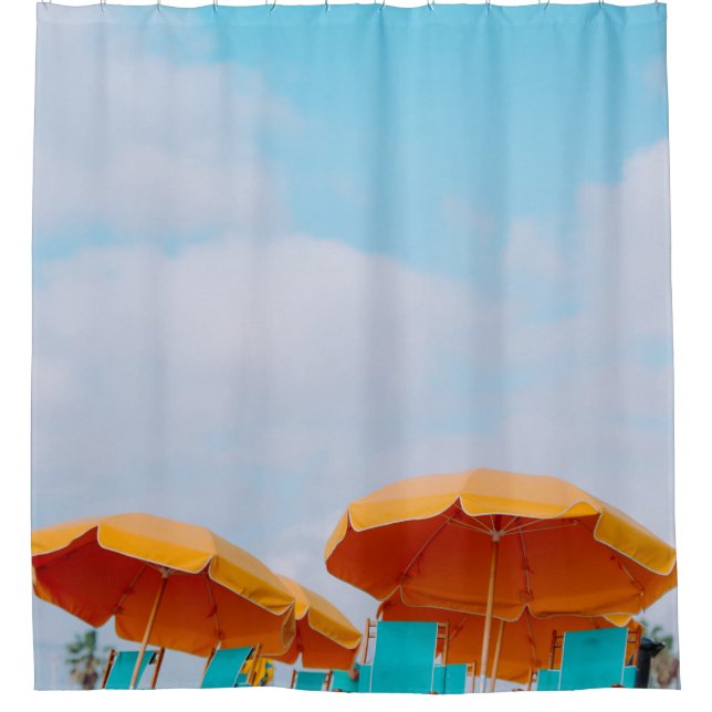 Closeup photo of lounger chairs and beach umbrella (Front)