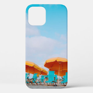 Closeup photo of lounger chairs and beach umbrella iPhone 12 case