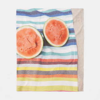 Closeup photo of slice watermelon fruits on cloth fleece blanket
