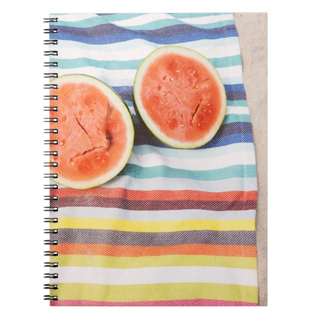 Closeup photo of slice watermelon fruits on cloth notebook (Front)