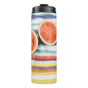 Closeup photo of slice watermelon fruits on cloth thermal tumbler