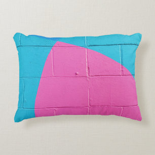 Closeup photo of teal and pink wall accent pillow