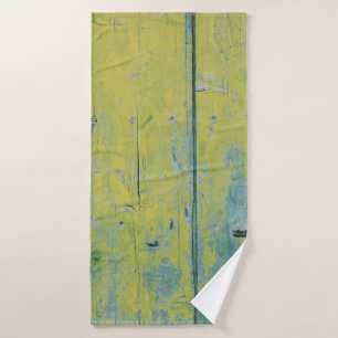 Closeup photo of yellow and teal wooden board bath towel