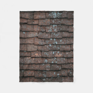 Closeup photography of brown and grey concrete bri fleece blanket