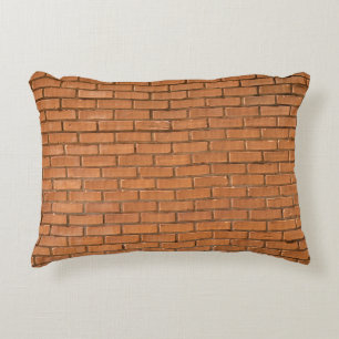 Closeup photography of brown brick wall accent pillow