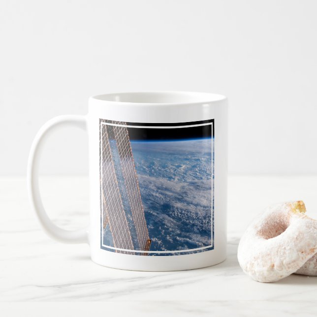 Cloud-Covered Tasman And Coral Seas. Coffee Mug (With Donut)