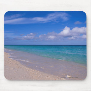 Cloud in blue sky over sandy beach mouse pad