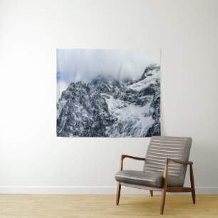 Clouds covering majestic mountains tapestry