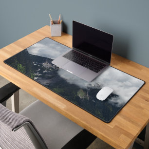 Clouds covering mountains desk mat