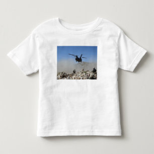 Clouds of dust kicked up by the rotor wash toddler t-shirt