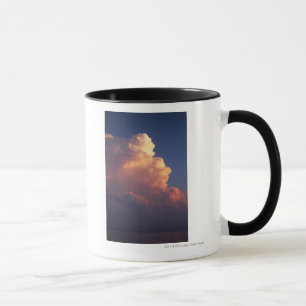 Clouds over sea at sunset mug