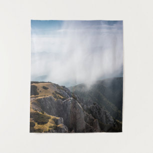 Clouds rolling over mountains tapestry