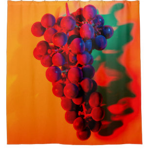 Cluster of blue grape in orange neon light. Food b