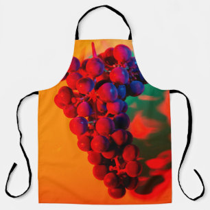 Cluster of blue grape in orange neon light. Food b Apron