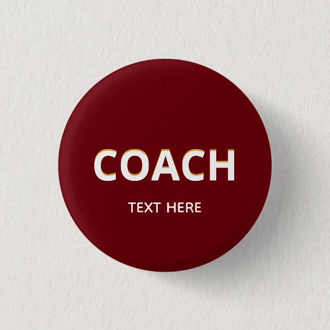 Coach text on maroon 1 inch round button (Front)