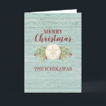 Coastal Beach Holiday Christmas Card<br><div class="desc">A rustic beach themed Christmas card decorated with a sand dollar and Christmas foliage. Personalize it with your name for Christmas this year! Designed for you by Blackberry Boulevard.</div>