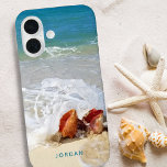 Coastal Beach Shells Seashore Photo Name iPhone 16 Case<br><div class="desc">Personalized cell phone case with your own full-bleed photo (or use the sample one) and custom text in your choice of font style and color. The sample photo features a coastal beach shoreline and conch seashells with waves crashing over them on a sandy beach with calm, relaxing turquoise blue ocean...</div>