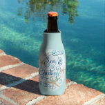 Coastal Christmas SEAS & GREETINGS Personalized Bottle Cooler<br><div class="desc">Personalized coastal or beach themed Christmas holiday season bottle cooler featuring an elegant calligraphy script SEAS & GREETINGS accented with starfish in turquoise, aqua, teal and blue colours with optional custom text against an editable light turquoise background colour for your holiday entertaining. ASSISTANCE: For help with design modification or personalization,...</div>