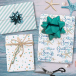 Coastal Christmas SEAsons Greetings Script Wrapping Paper Sheet<br><div class="desc">Tropical coastal Christmas greeting SEAsons Greetings in a decorative script typography design with starfish on one sheet, coordinating turquoise and gold dots on a sheet and coordinating turquoise stripes on another for a trio of beach themed giftwrap for the holidays. Contact the designer via Zazzle Chat or makeitaboutyoustore@gmail.com if you'd...</div>