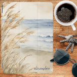 Coastal Sea Oats Monogram iPad Air Cover<br><div class="desc">Escape to the tranquil shores with our exclusive customizable iPad cover featuring a breathtaking watercolor graphic of a serene beach scene adorned with swaying sea oats. It gives a whole new meaning to surfing the internet!</div>