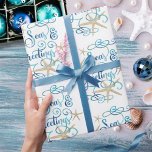 Coastal Tropical Christmas SEAsons Greetings Wrapping Paper<br><div class="desc">Wrap your Christmas holiday gifts in a tropical, coastal vibe featuring SEAS & GREETINGS in an elegant calligraphy script typography design accented with starfish in turquoise aqua blue colours on an editable white background. ASSISTANCE: Contact the designer via Zazzle Chat or makeitaboutyoustore@gmail.com if you'd like this design modified or on...</div>