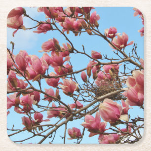 coaster with tree of pink blossom, bird's nest