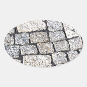 Cobblestones of a street in detail oval sticker