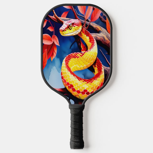 Cobra with vibrant red and yellow scales in tree pickleball paddle (Front)