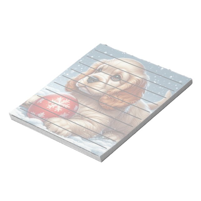 Cocker Spaniel Puppy Resting on Snow With a Ball  Notepad (Rotated)
