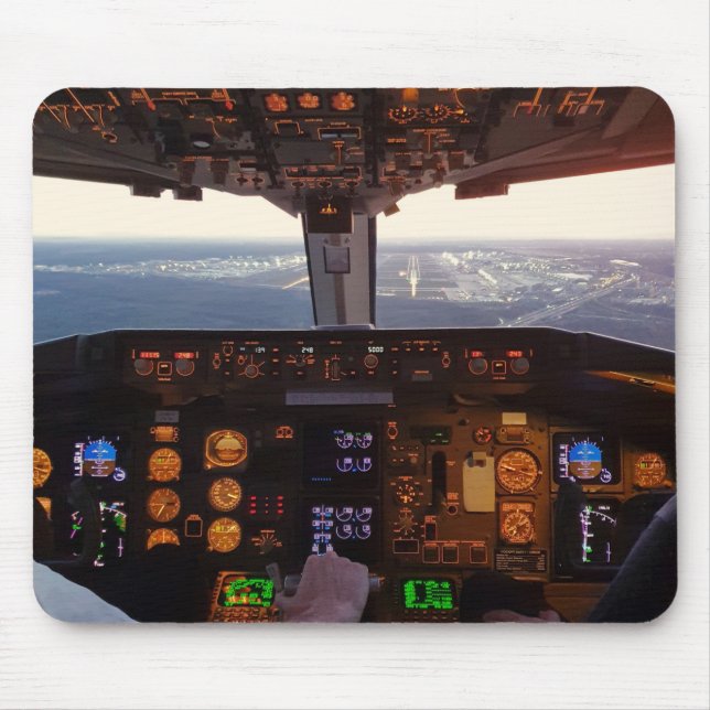 Cockpit view of commercial jet airplane landing on mouse pad (Front)