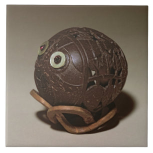 Coconut sculpted into a face, c.1895 tile