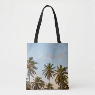 Coconut trees under cloudy sky in the morning tote bag