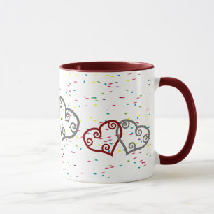 Coeurs de fiançailles de monogramme avec la tasse