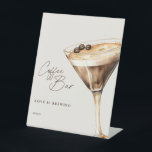 Coffee Bar Bridal Shower Espresso Martini Pedestal Sign<br><div class="desc">A sophisticated nod to elevated entertaining, this espresso martini-inspired coffee bar sign brings a refined touch to your bridal shower, engagement party, or wedding celebration. With fluid script typography and a hand-painted cocktail illustration, it sets the scene for a stylish, indulgent moment—where guests can sip, savour, and celebrate in effortless...</div>
