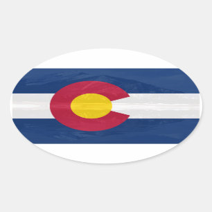 Colorado flag with mountain background oval sticker