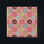 Colorful Donut Pattern Cute Sweet Treats 2 Inch Square Button<br><div class="desc">Express your love for sweets with this cute donut pattern button pin. This small but eye-catching accessory features a detailed illustration of colorful glazed doughnuts and sprinkles on a pink background. It is a perfect way to personalize your denim jacket, backpack, or hat with a touch of kawaii flair. These...</div>