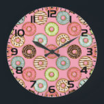 Colorful Donut Pattern Cute Sweet Treats Large Clock<br><div class="desc">Keep track of time with a touch of sweetness using this colorful donut pattern wall clock. This decorative timepiece features a seamless illustration of various glazed doughnuts and sprinkles on a soft pink background. It is an ideal addition to kitchens, bakeries, kids rooms, or home offices where a playful aesthetic...</div>