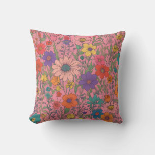 Colorful floral pattern on pink throw pillow