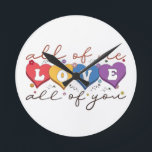 Colorful Heart Love Quote Round Clock<br><div class="desc">Express deep love and connection with this beautiful “All of Me Loves All of You” design. Featuring vibrant heart-shaped letters, soft floral accents, and elegant handwritten typography on a dark background, this artwork is perfect for couples, anniversaries, Valentine’s Day, weddings, or romantic gifts. Its warm, heartfelt message makes it ideal...</div>