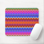 Colorful mouse pad featuring vibrant zigzag<br><div class="desc">Colorful mouse pad featuring vibrant zigzag stripes in pink,  blue,  orange,  and green hues. A white mouse rests beside it on a light surface.</div>