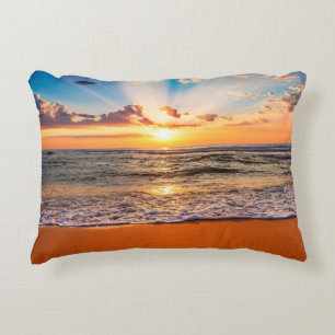 Colorful ocean beach sunrise with deep blue sky an accent pillow