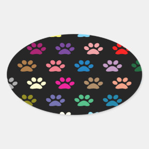 Colorful puppy paw prints on black oval sticker