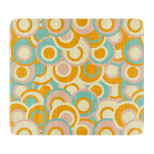 Colorful retro pattern in pastel shades of orange cutting board